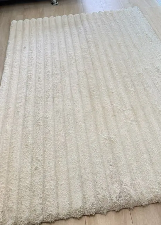 Cream area rug after cleaning